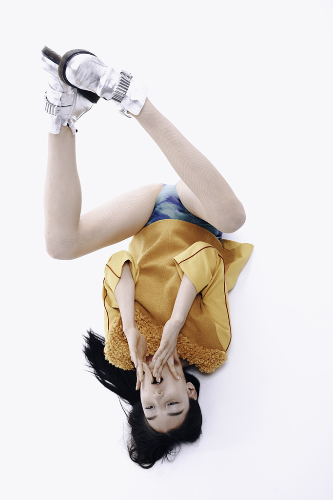 Top: Nicola Brindle, Shorts: Sasha Louise, Shoes: McQ by Alexander McQueen.