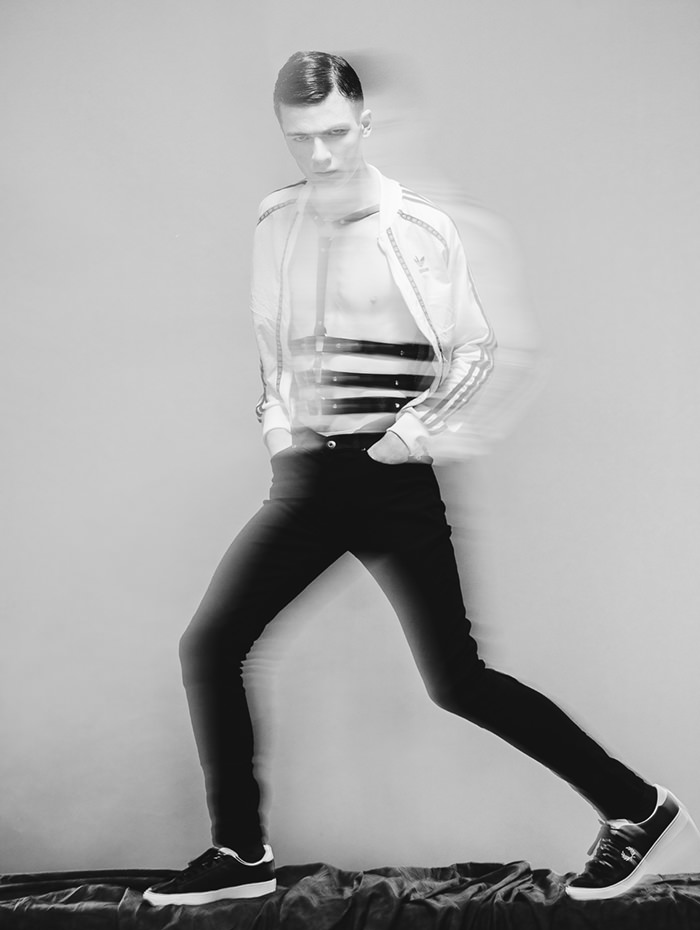 FELIX is wearing Jacket - Adidas, Harness - Zana Bayne, Jeans - Religion, Shoes - Fred Perry