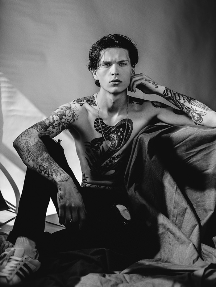 JOE is wearing Chain and jeans - artists own, Shoes - Adidas