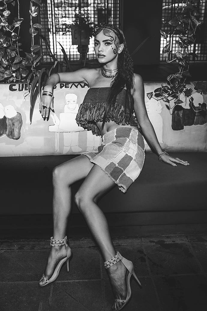Curb Chain Toggle Necklace: Michael Kors Cage Choker Necklace: Gabriela Artigas Gold Ring Set: H&M Denim Fringe Bandeau: A.B Hombre by Z. De Sousa & A. Beltran Blue Denim Patchwork Skirt: Zanadi Studded Triple Strap Sandals: Schutz