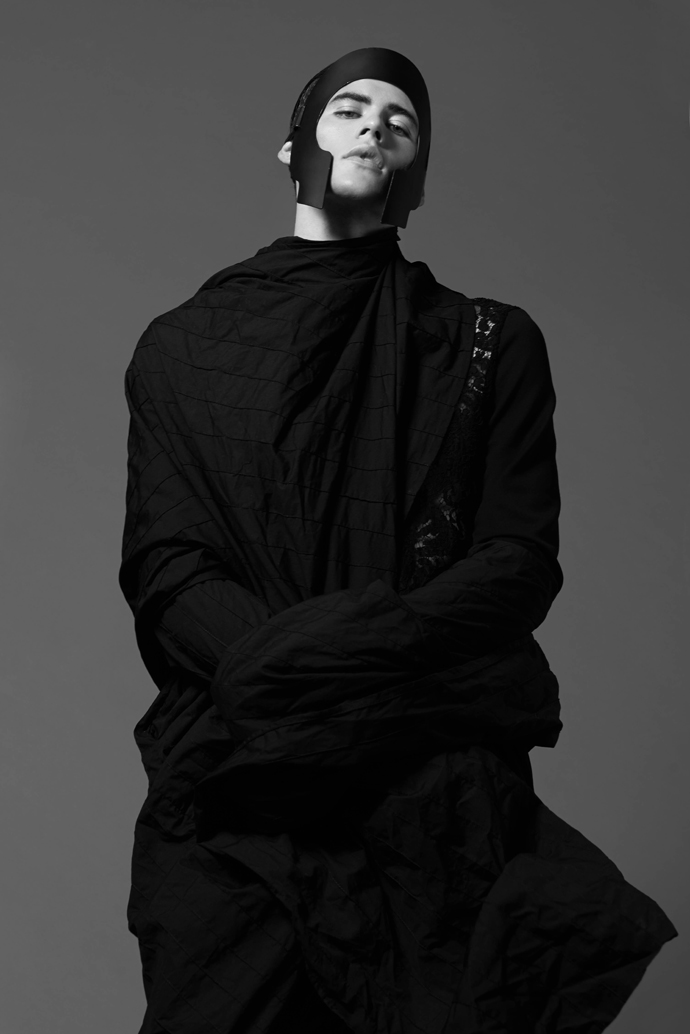 Mask: And I  Trench coat: Mashael Alrajhi  Jumper: Aux corps anonymes
