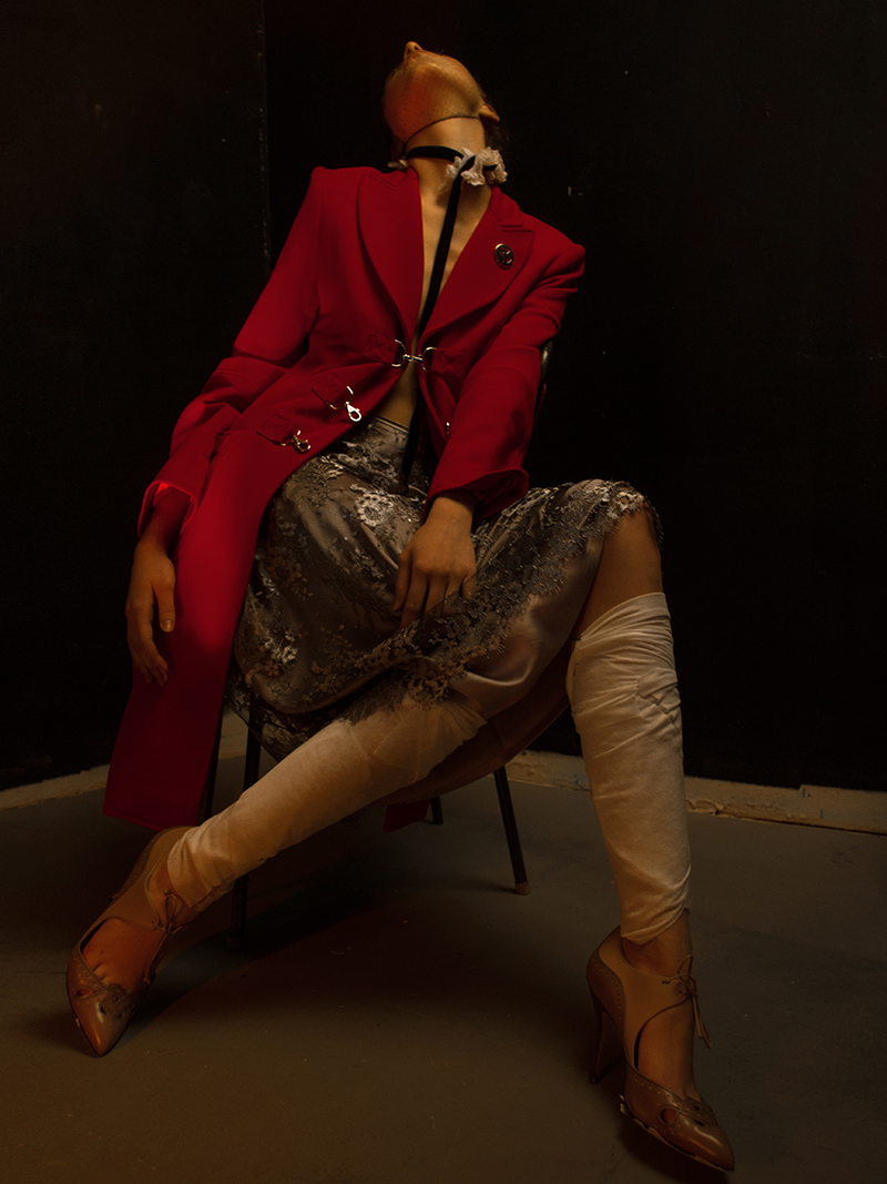 Coat: Moschino, Skirt: Escada, Collar: Dolce Gabbana, Shoes: Ferragamo