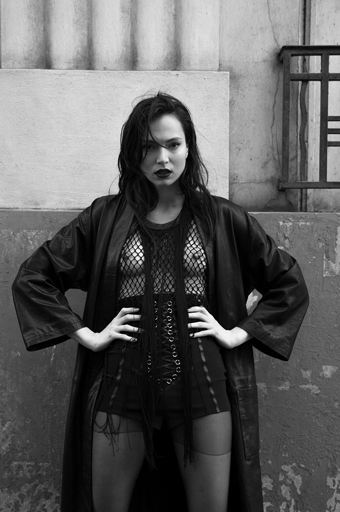long leather coat : AINUR TURISBEK fringed mesh top : Augustin Teboul short : Elisabetta Franchi high boots : Musette Paris