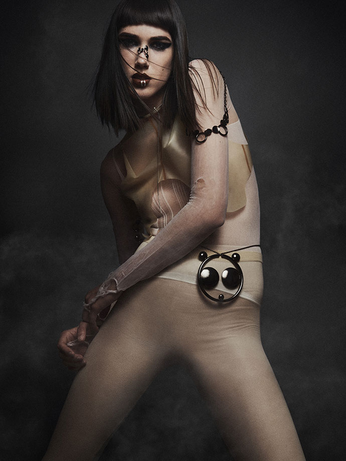 Latex top by Alex Ulichny, Bodysuit torn Nylon , Waist Panda, Nose ring and shoulder jewelry by Edgar Mosa, Lip rings & neck choker by AKA Jewelry
