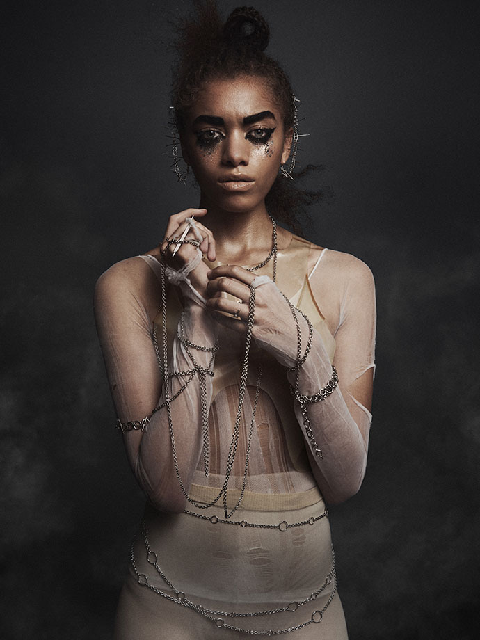 Latex top by Alex Ulichny Bodysuit torn Nylon, Body and ear chains by Edgar Mosa, Rings by AKA Jewelry