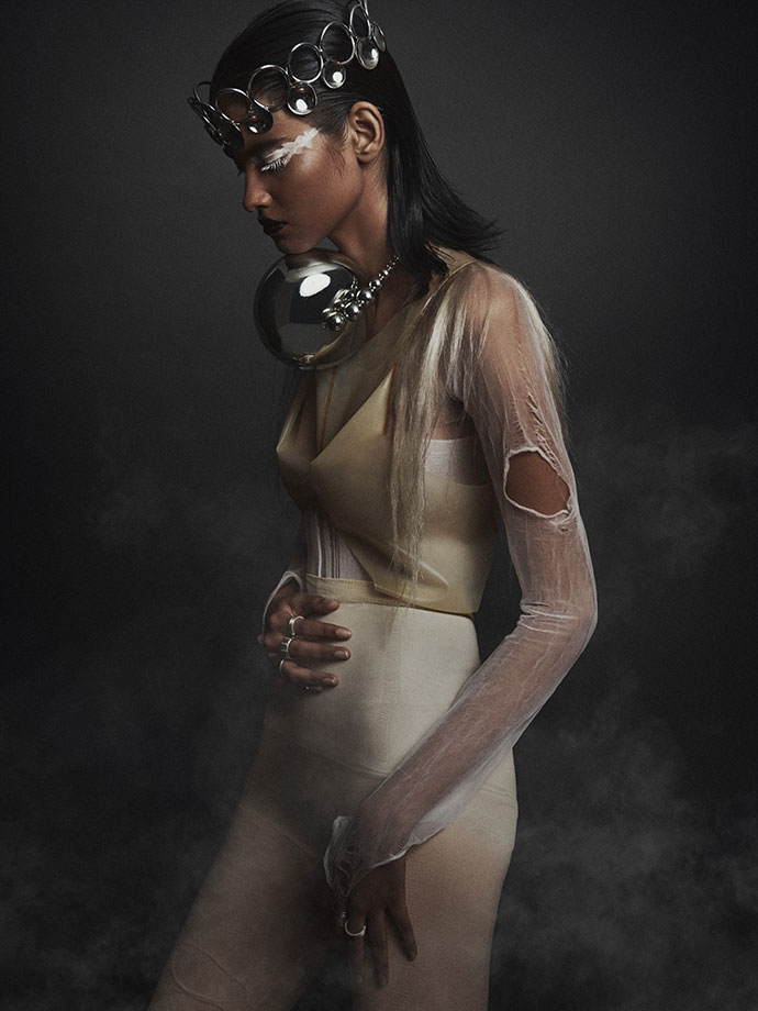 Latex top by Alex Ulichny Bodysuit torn Nylon, Necklace and crown by Edgar Mosa, Rings by AKA Jewelry & some vintage rings