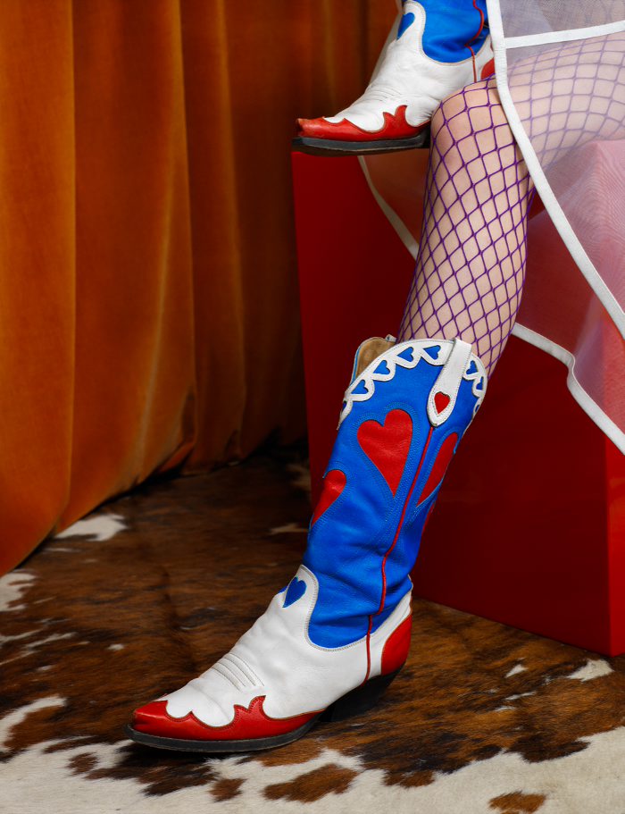 Skirt by Raf Simons Fishnets by Wolford Boots by Charros