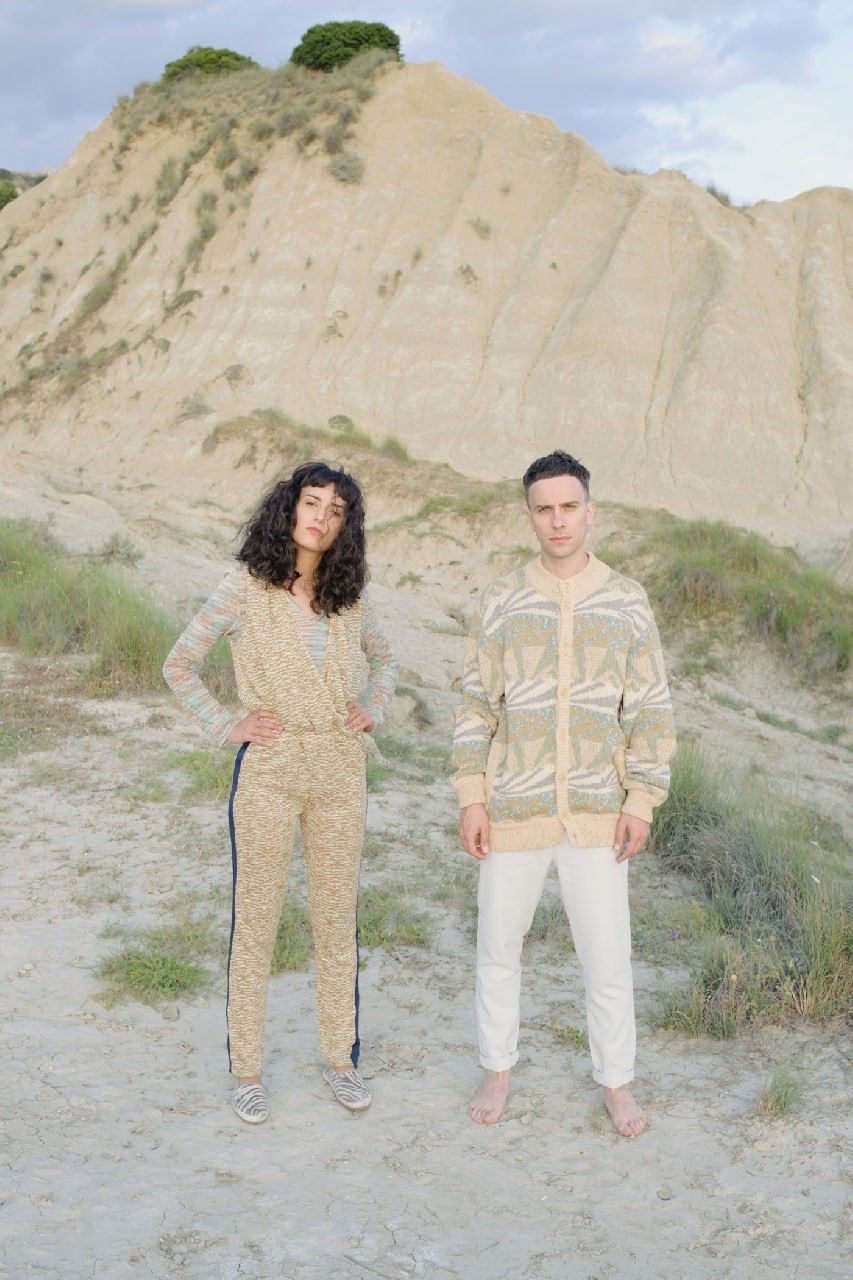 Cyen wears: top Missoni Vintage, jumpsuit and shoes model’s own. Alfredo wears: sweater Missoni Vintage, trousers stylist’s own.