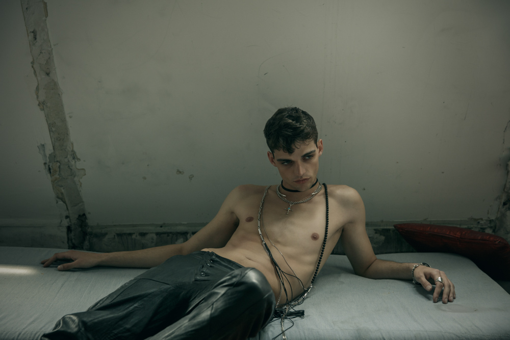 Leather pants by Sandrine Philippe Cross necklace by Harpo Silver plated metal, leather men bracelet from Tribal collection by Delphine-Charlotte Parmentier Ring by Harpo