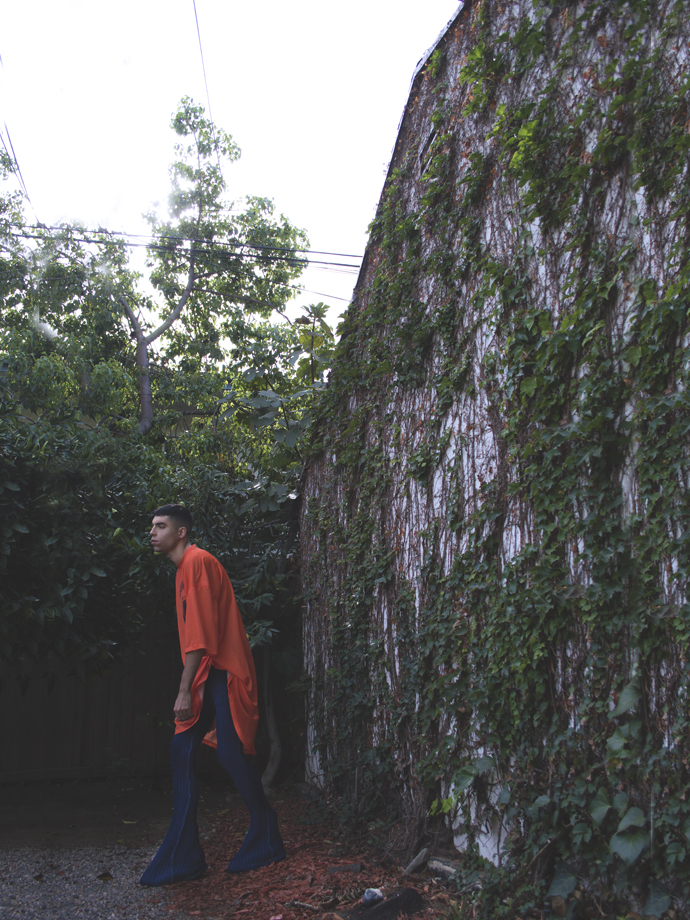Orange mesh top- Digby Jackson London Dark wash denim knit pants- Knorts